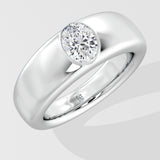Silver ring with a solitaire diamond on a light gray background
