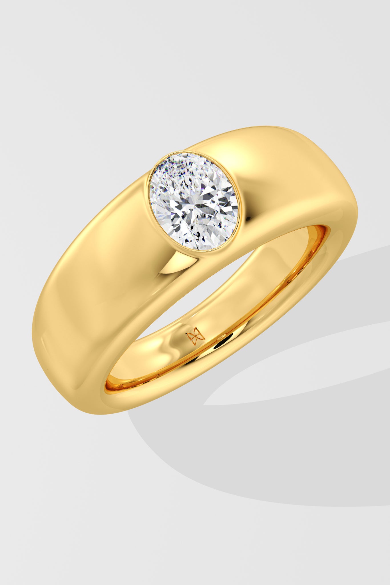 Gold ring with a solitaire diamond on a light gray background