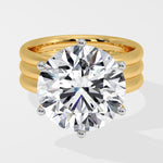 Gold diamond ring with a large diamond on a white background