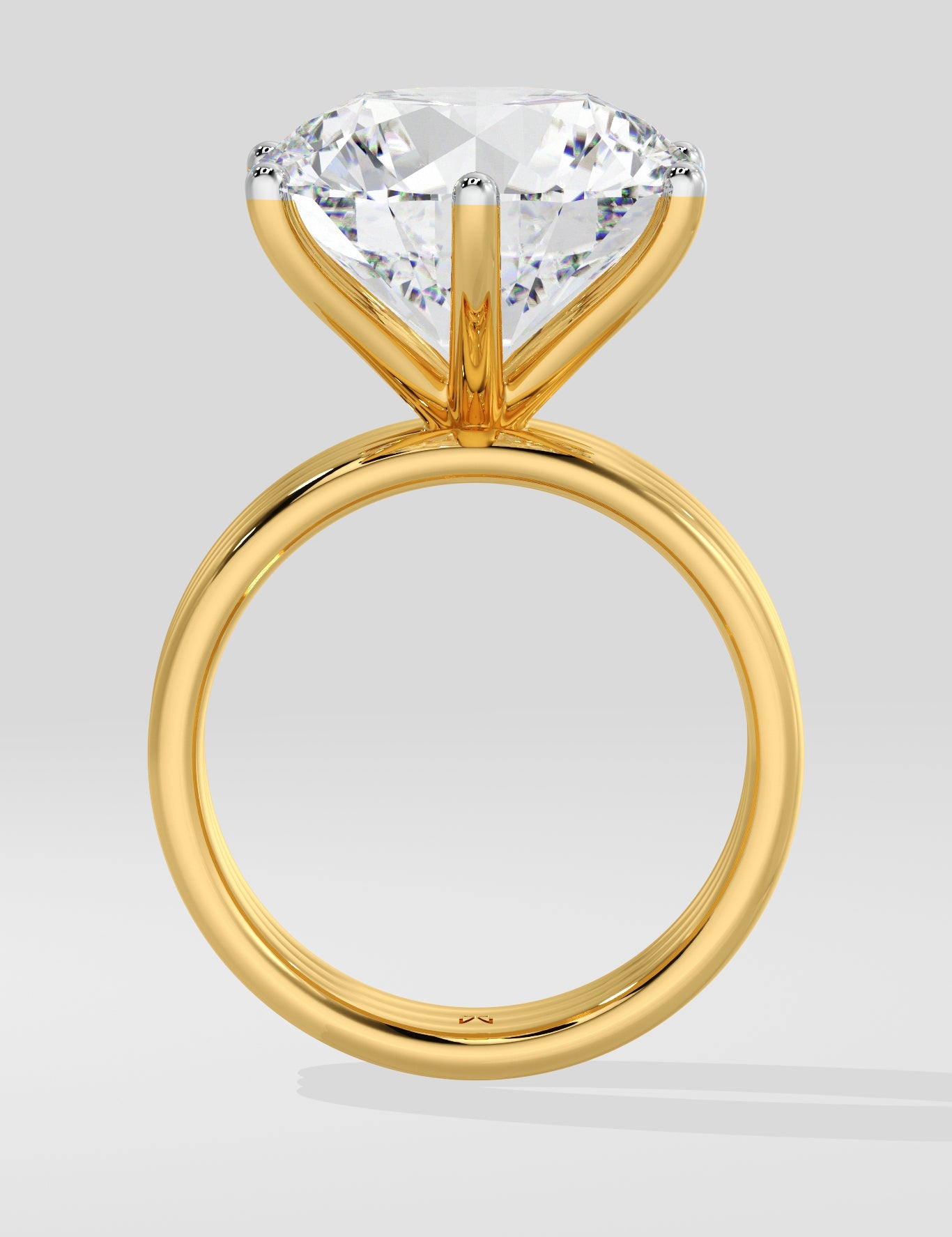 Gold diamond ring with a large diamond on a light gray background