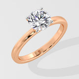 Rose gold ring with a la grown diamond on a light gray background