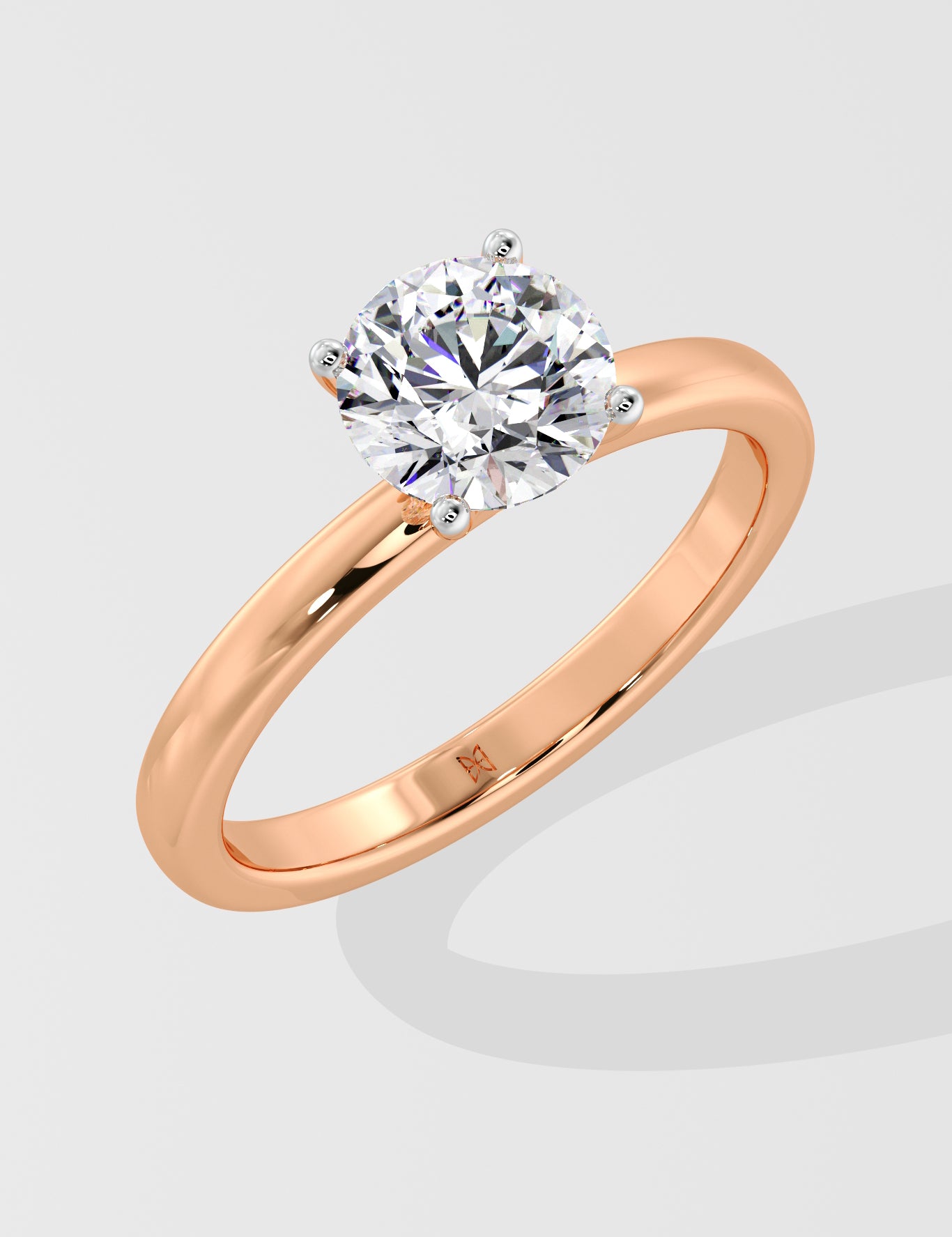Rose gold ring with a la grown diamond on a light gray background