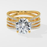 Gold ring with multiple diamond-studded bands on a white background