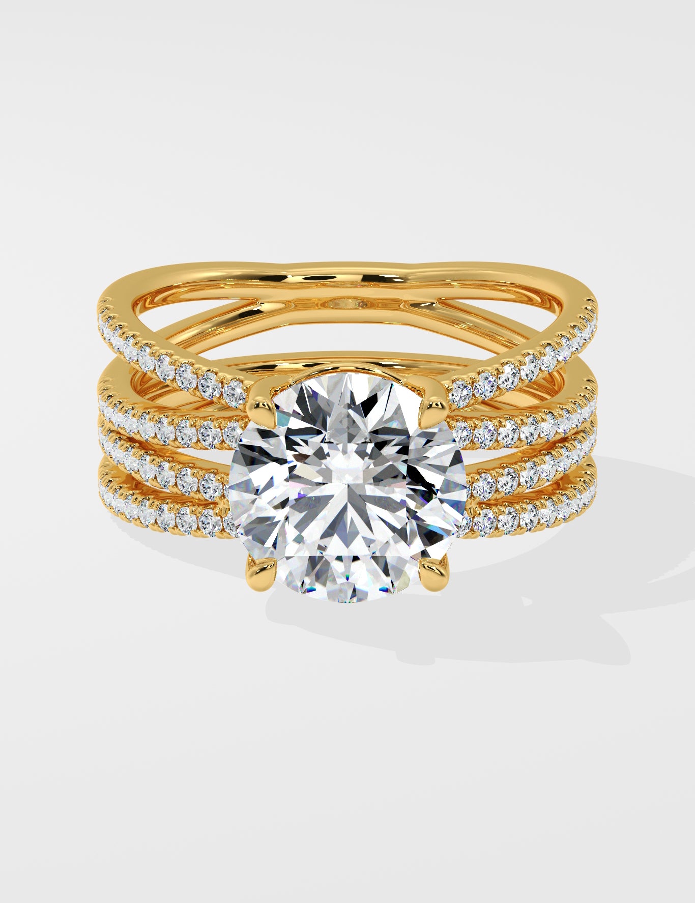 Gold ring with multiple diamond-studded bands on a white background