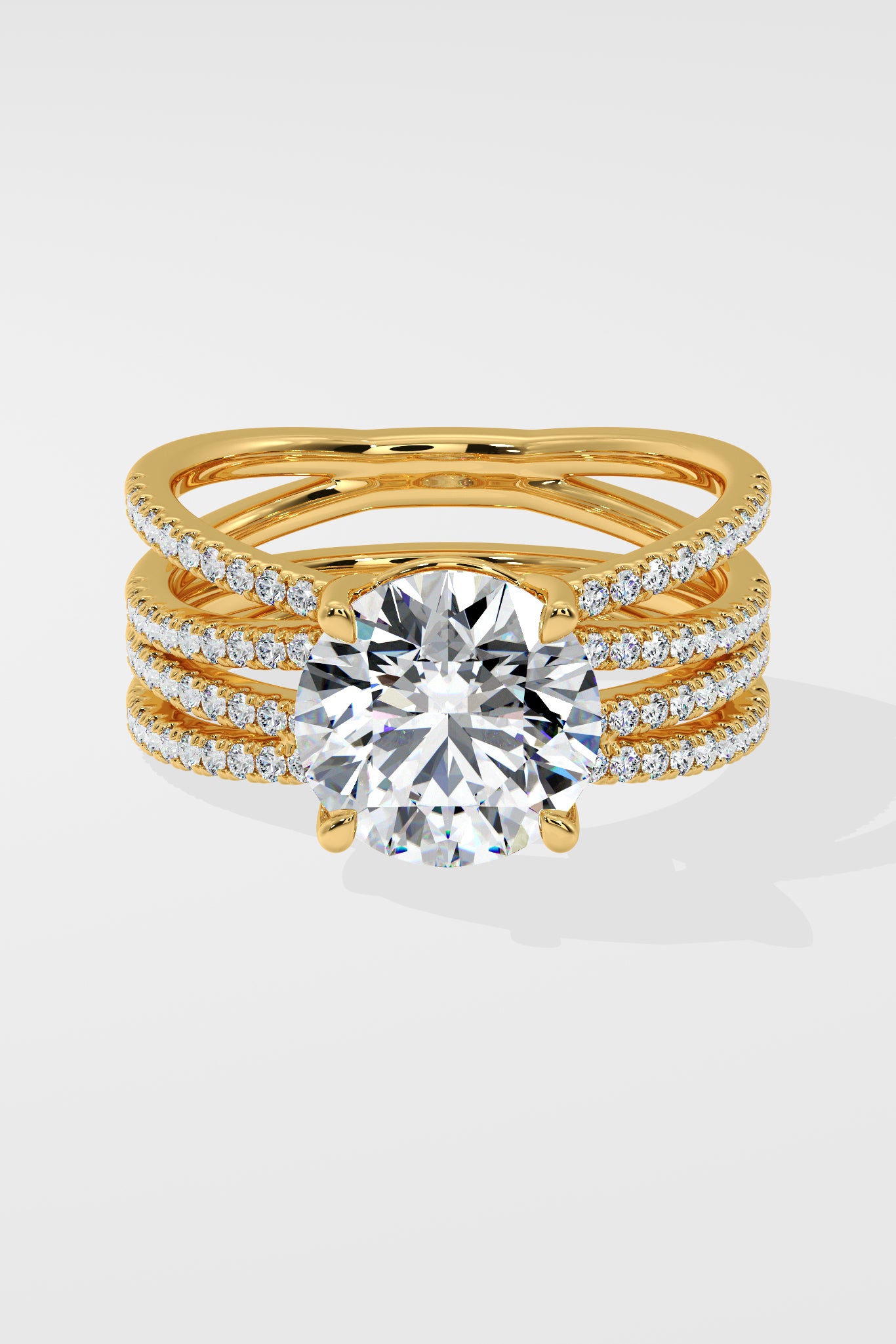 Gold ring with multiple diamond-studded bands on a white background