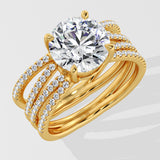 Gold ring with a large lab grown diamond and smaller diamonds on a white background