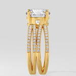 Gold ring with a large lab grown diamond and smaller stones on a light gray background