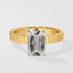 Diamond ring with a emerald diamond on a white background