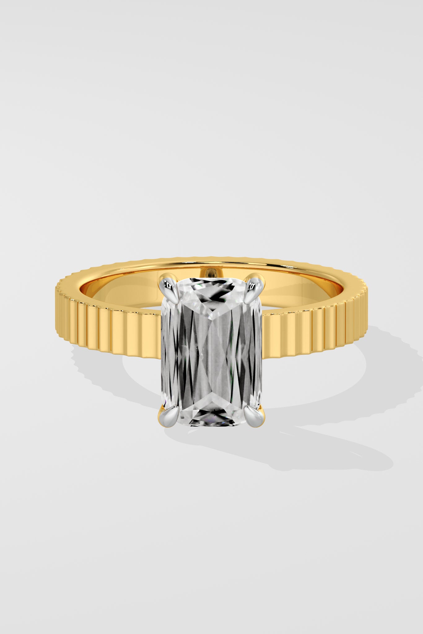 Diamond ring with a emerald diamond on a white background