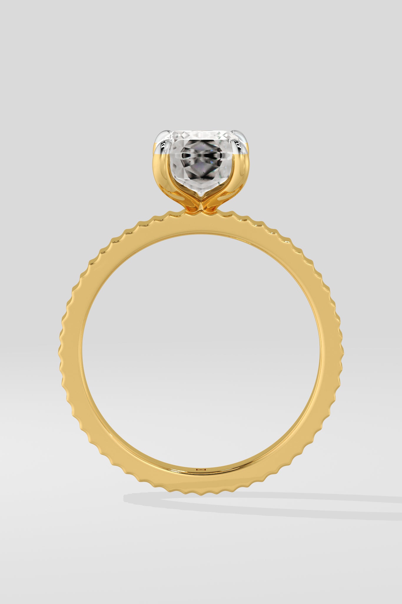 Diamond ring with a lab grown diamond on a light gray background