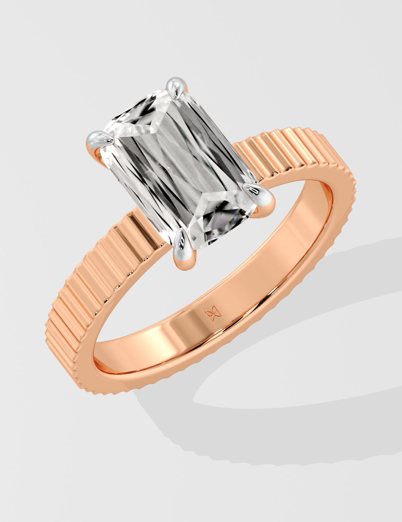 Diamond ring with a Emerald diamond on a white background