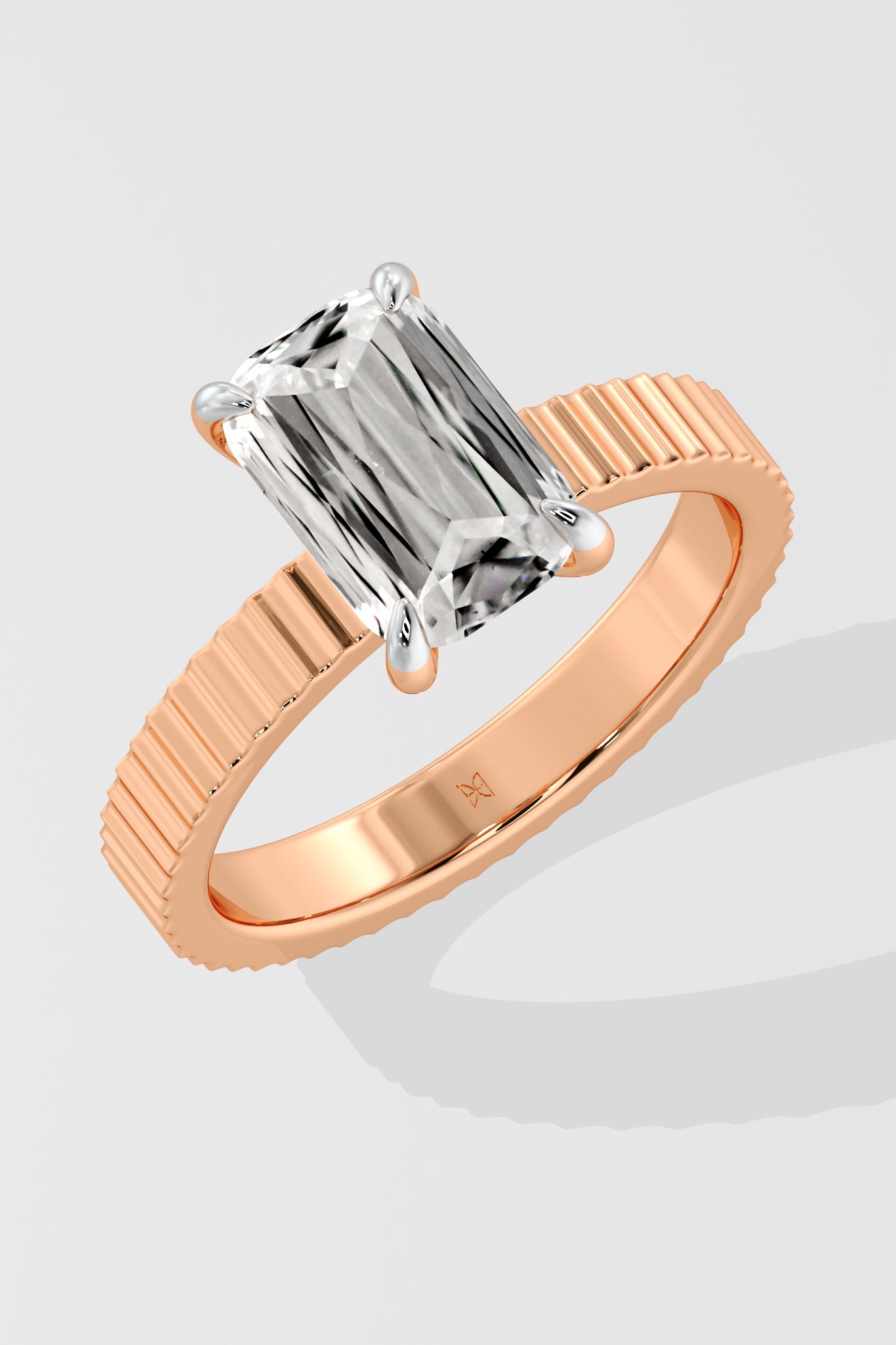 Diamond ring with a Emerald diamond on a white background