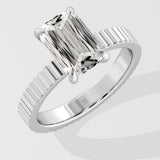 Diamond ring with a Emerald diamond on a white background