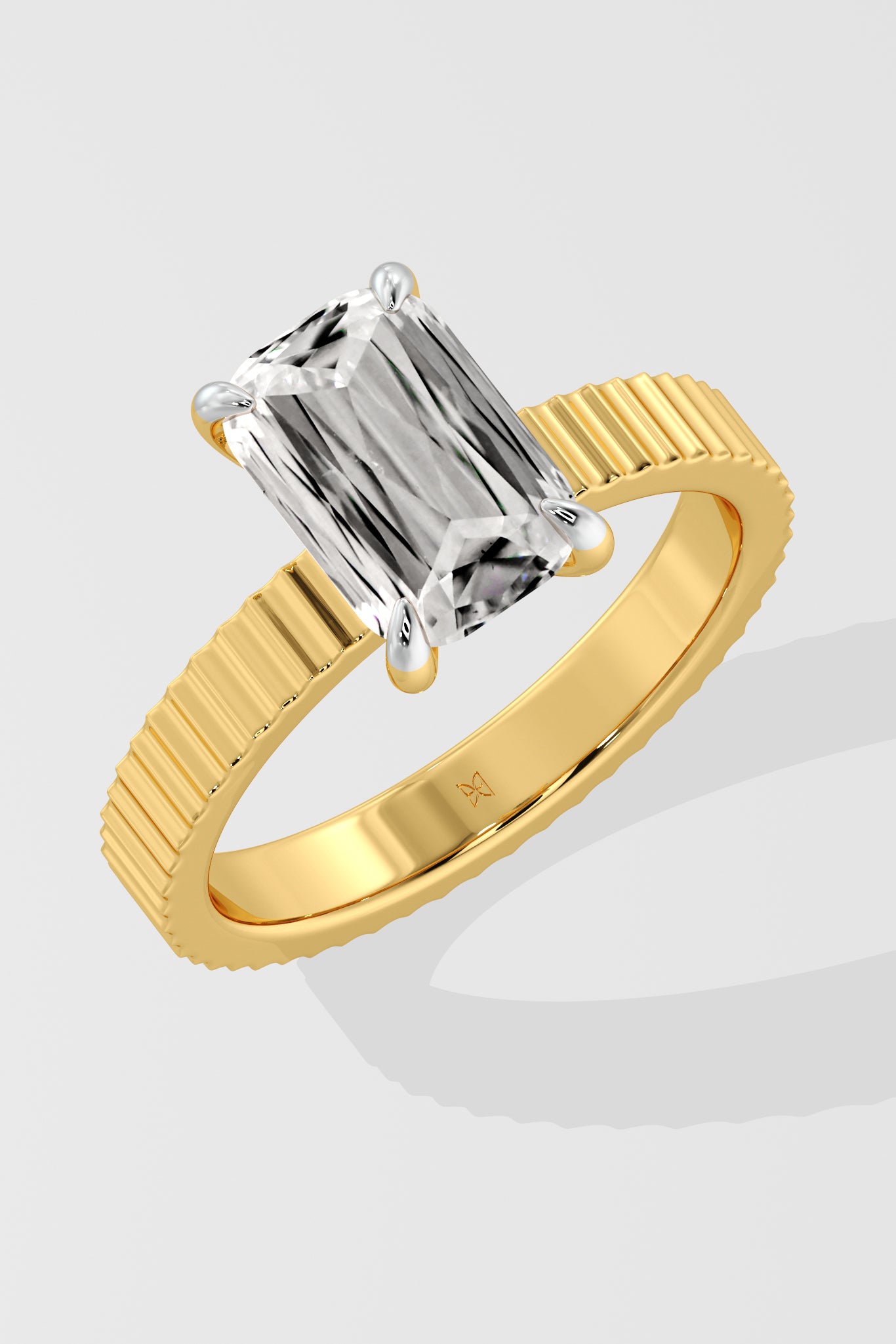 Diamond ring with a Emerald diamond on a white background