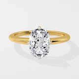 Gold ring with a large diamond on a light gray background