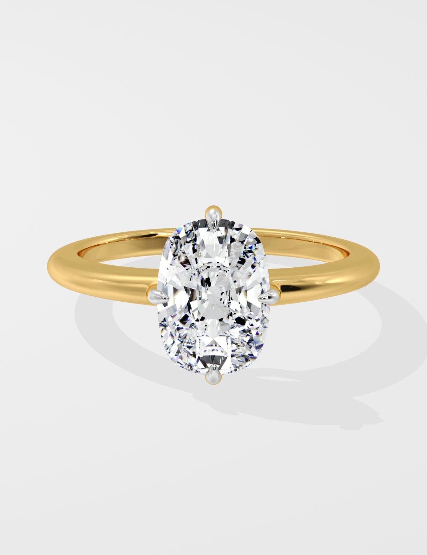 Gold ring with a large diamond on a light gray background