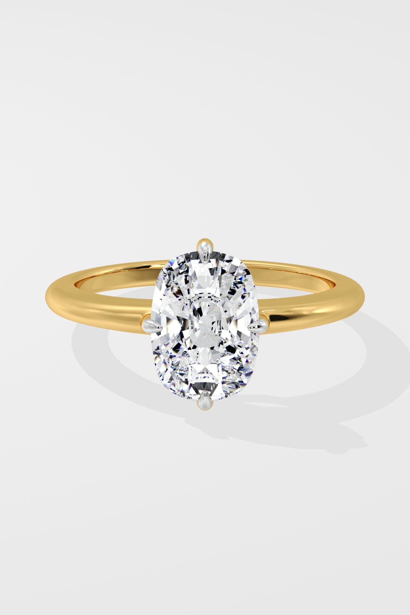 Gold ring with a large diamond on a light gray background