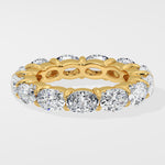 Diamond band ring with oval diamond on a light gray background