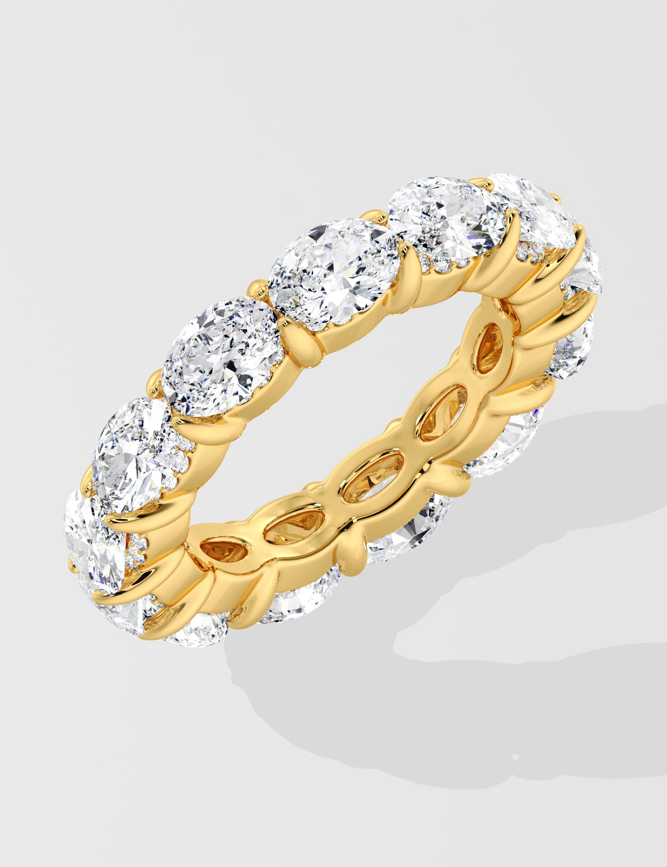 Diamond band ring with oval diamond on a light gray background