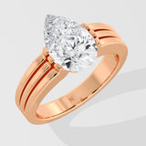 Rose gold pear diamond ring on a light gray background