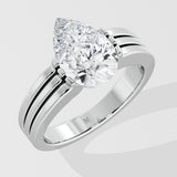 Silver pear diamond ring on a light gray background