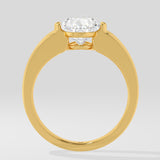 Gold diamond ring on a light grey background