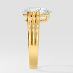 Gold pear diamond ring on a white background