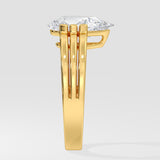 Gold pear diamond ring on a white background