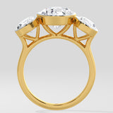 Gold Diamond ring with a large central gemstone and smaller stones on a light gray background
