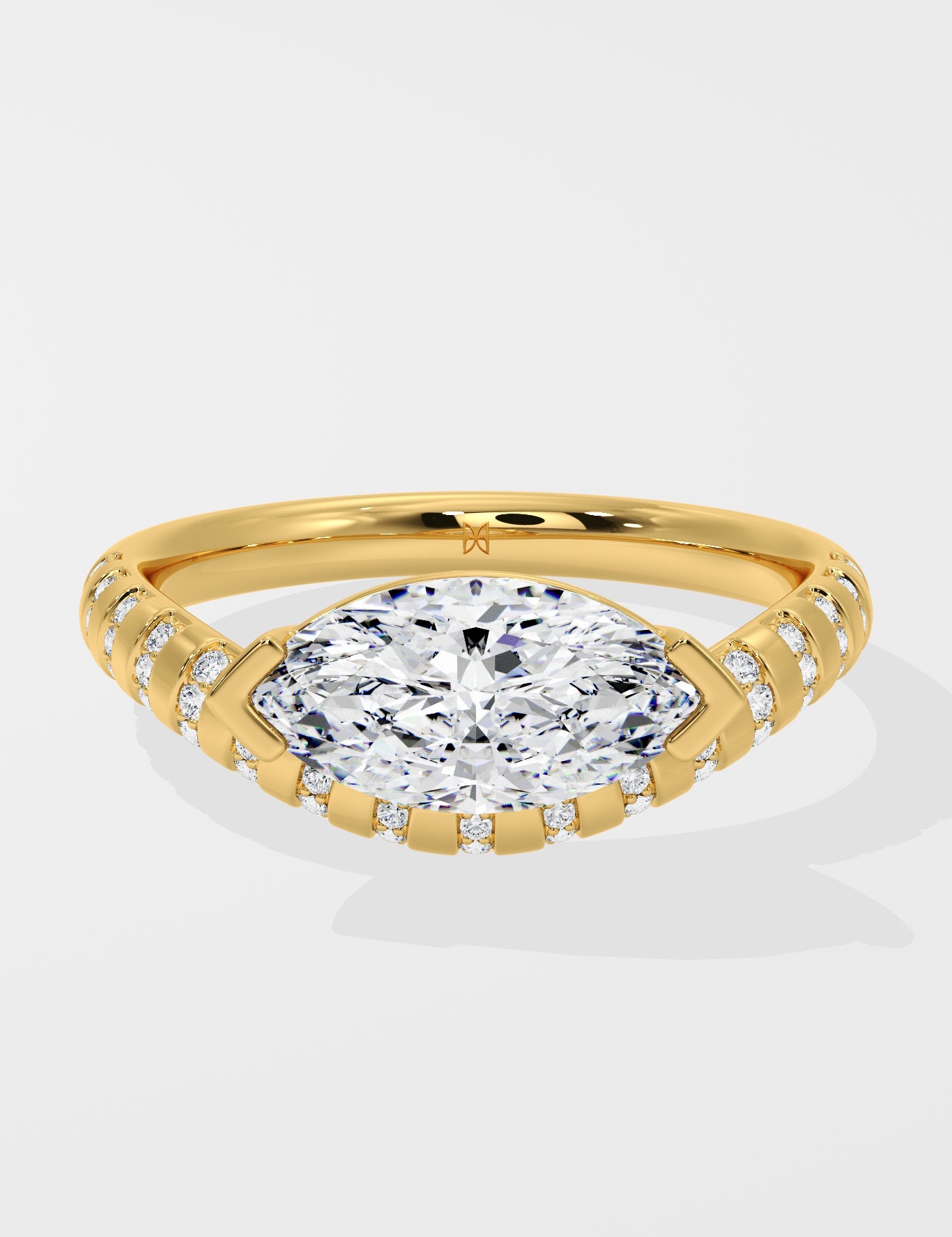 Diamond ring with a large diamond and smaller diamonds on the band against a white background