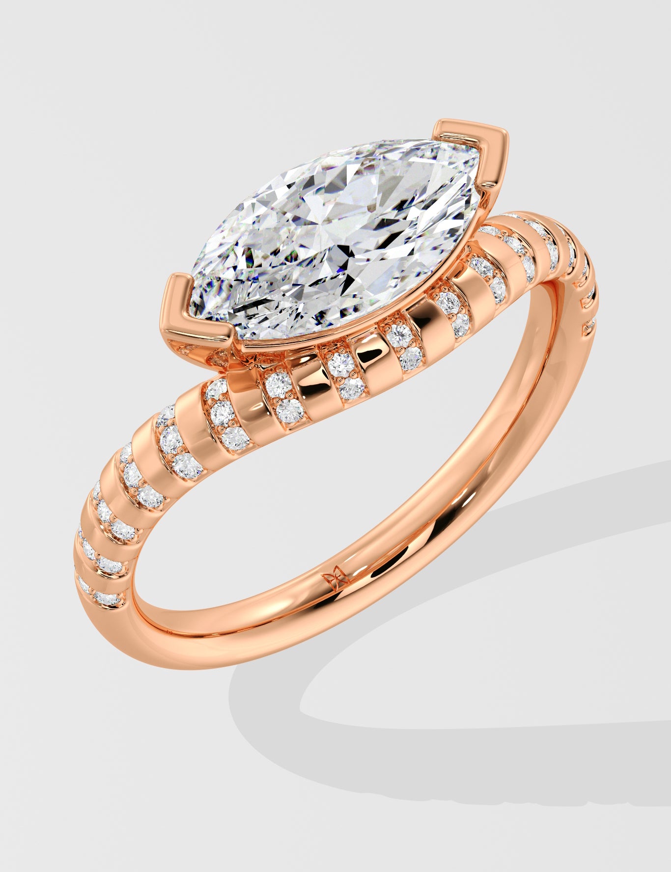 Rose gold diamond ring with a large diamond and smaller diamonds on the band against a light gray background