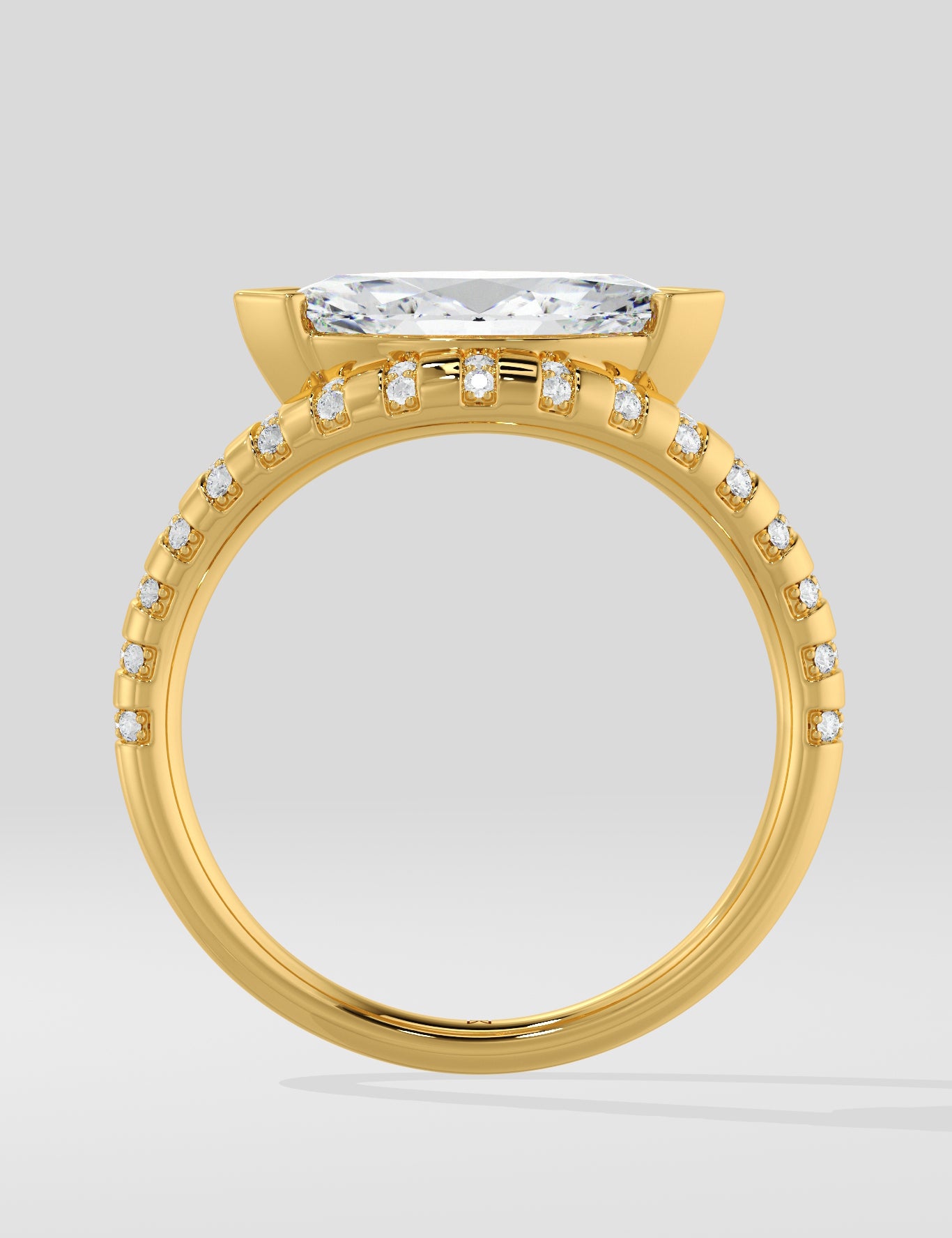 Diamond ring with a large diamond and smaller diamonds on the band against a light gray background